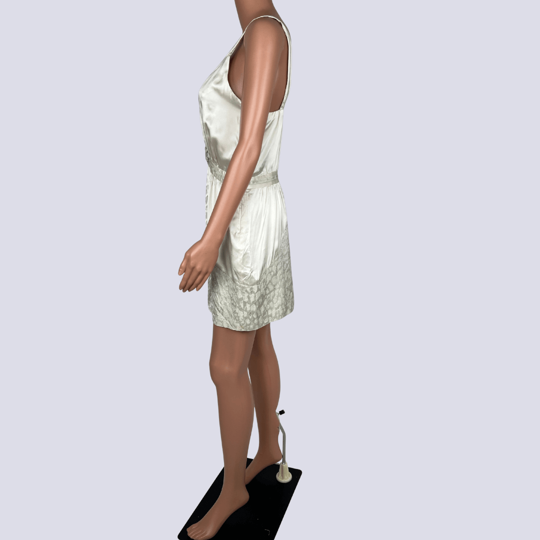 Side view of the Seduce silk cream mini dress