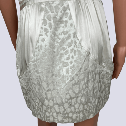 Back detail view of the Seduce silk cream mini dress