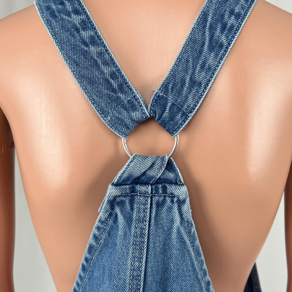 Back close up view of the Subtitled Women's Denim Mini Overall Pinafore