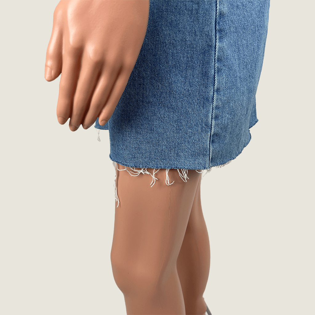 Side close up view of the Subtitled Women's Denim Mini Overall Pinafore