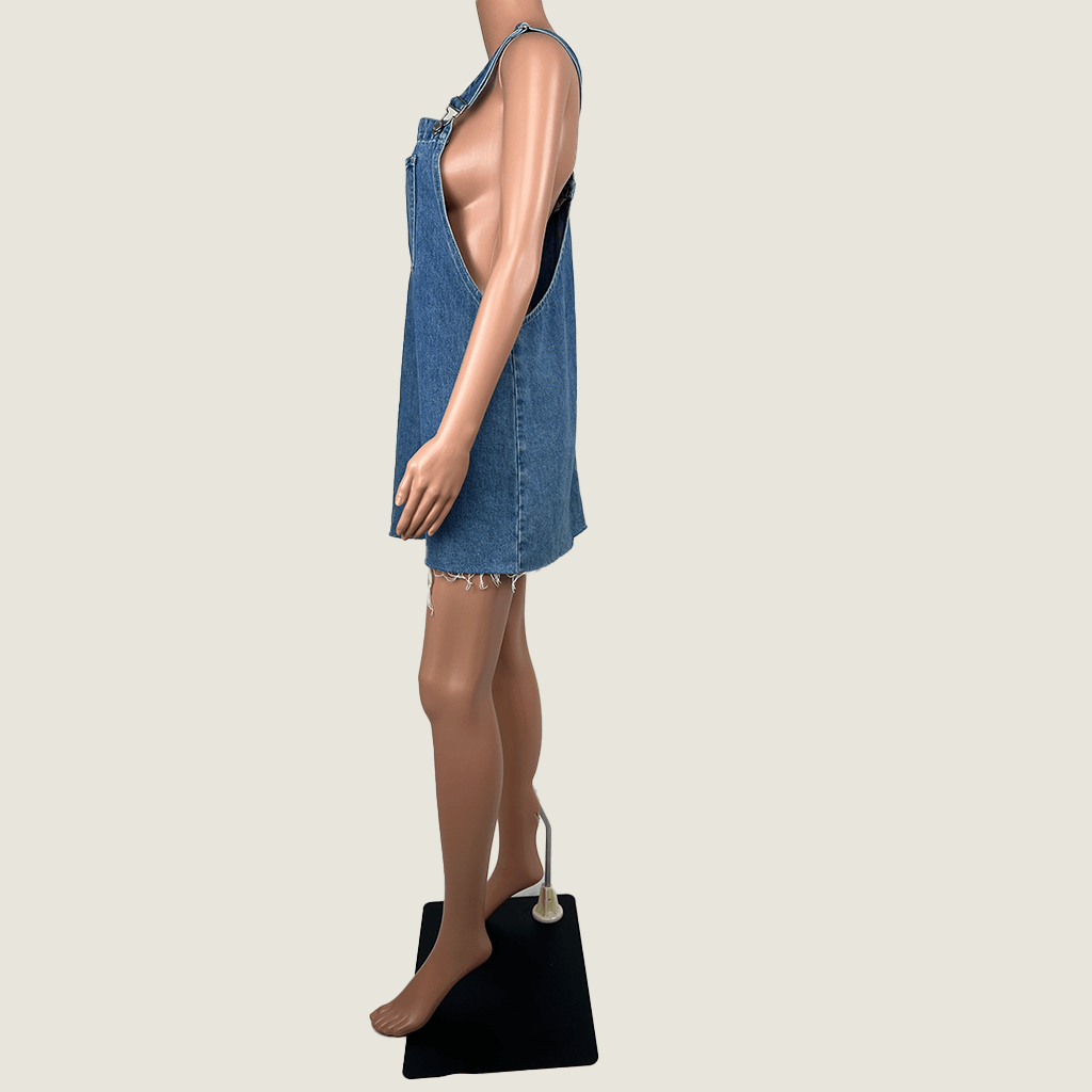 Side view of the Subtitled Women's Denim Mini Overall Pinafore