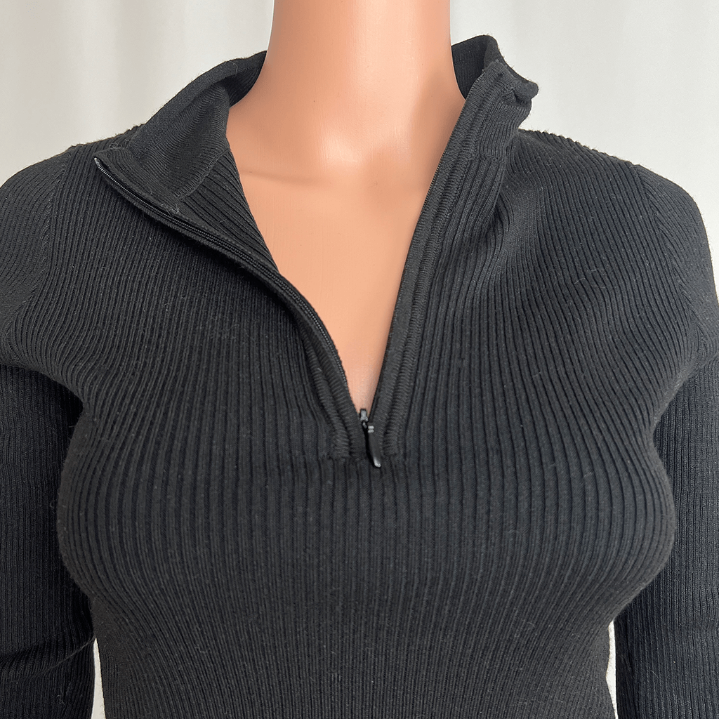 Collar zip open close up view of the Supre black knit jumper