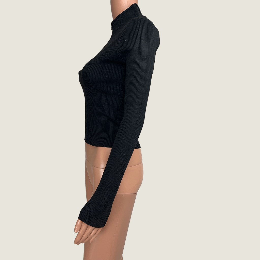 Side view of the Supre black knit jumper