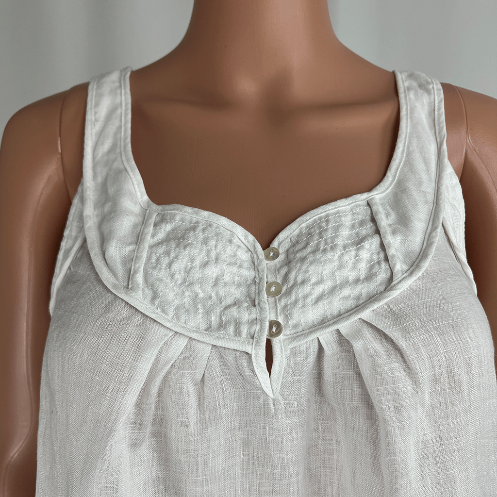 Front close up view of a Sussan white linen sleeveless tank top