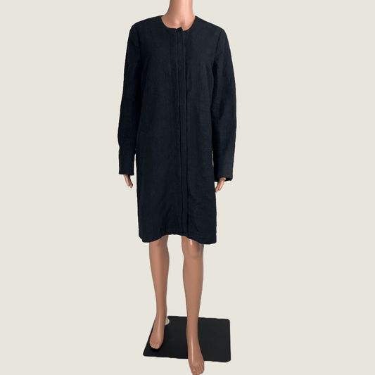 Front view of the Verge black collarless overcoat