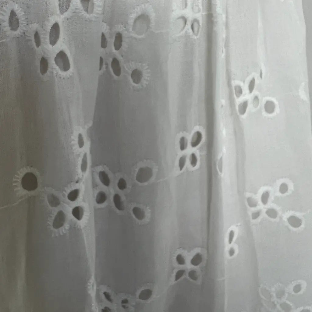 Fabric Detail View of a White Lace Summer Midi Dress 