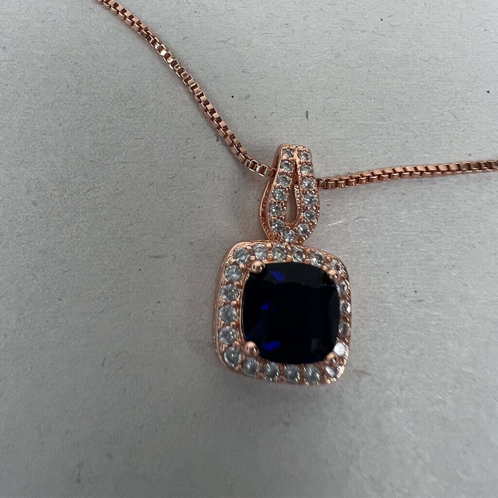 Gold filled with Cubic Zirconias and blue stone pendant