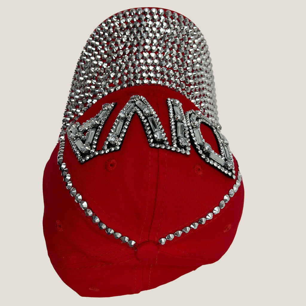 Lala red baseball hat with DIVA written with studs and gems upside down view