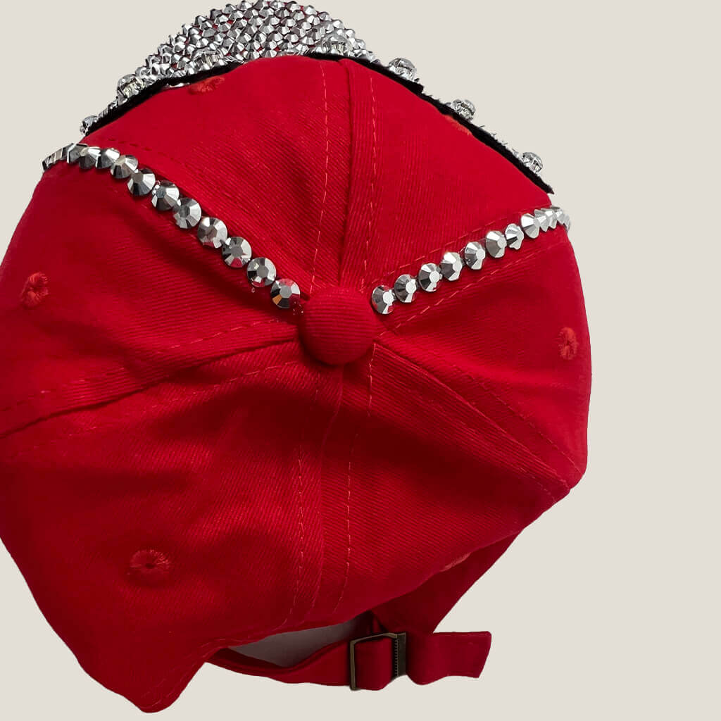 Lala red baseball hat with DIVA written with studs and gems top view