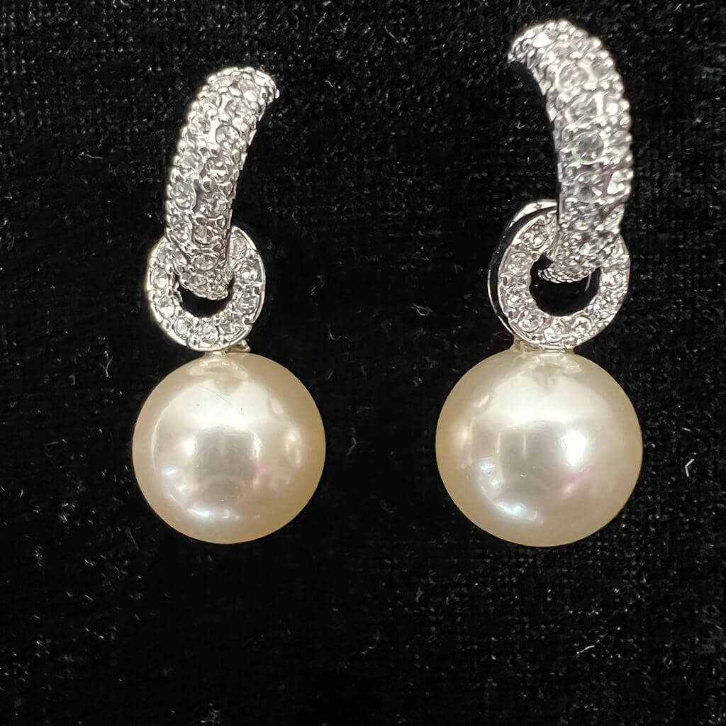 Crystal Drop Earrings With Pearl Feature Pair on Black