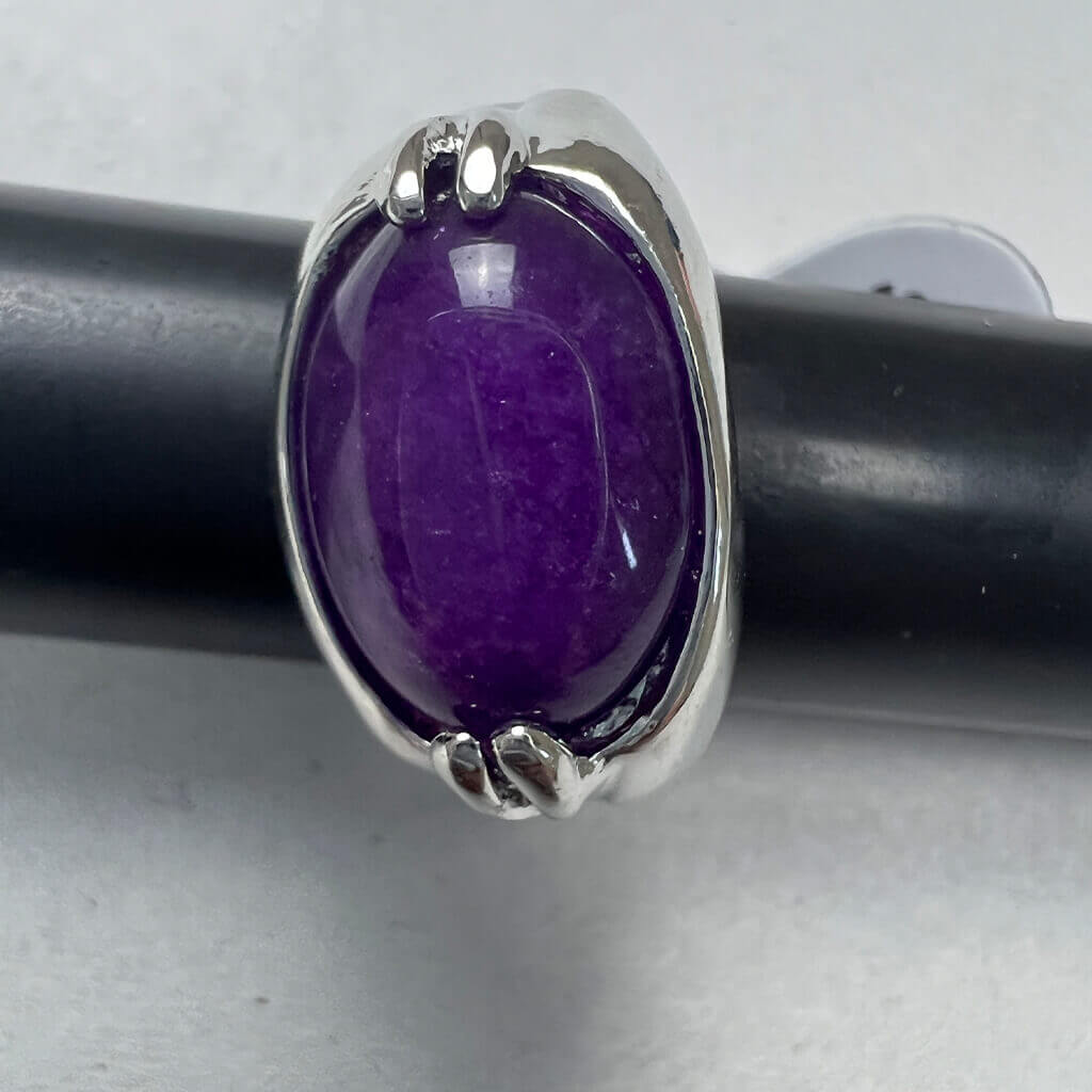 Silver Rings With Purple Stones Above Detail
