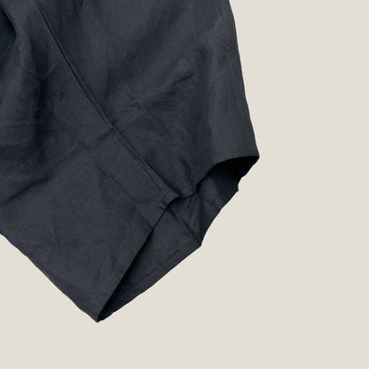 Sassind black linen asymmetric pant open hem detail